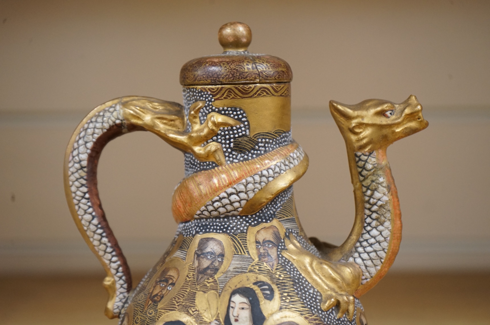 A Japanese Satsuma teapot and cover, signed, 17cm